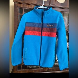 Cotopaxi Blue Fleece Jacket with Red and Navy Stripes